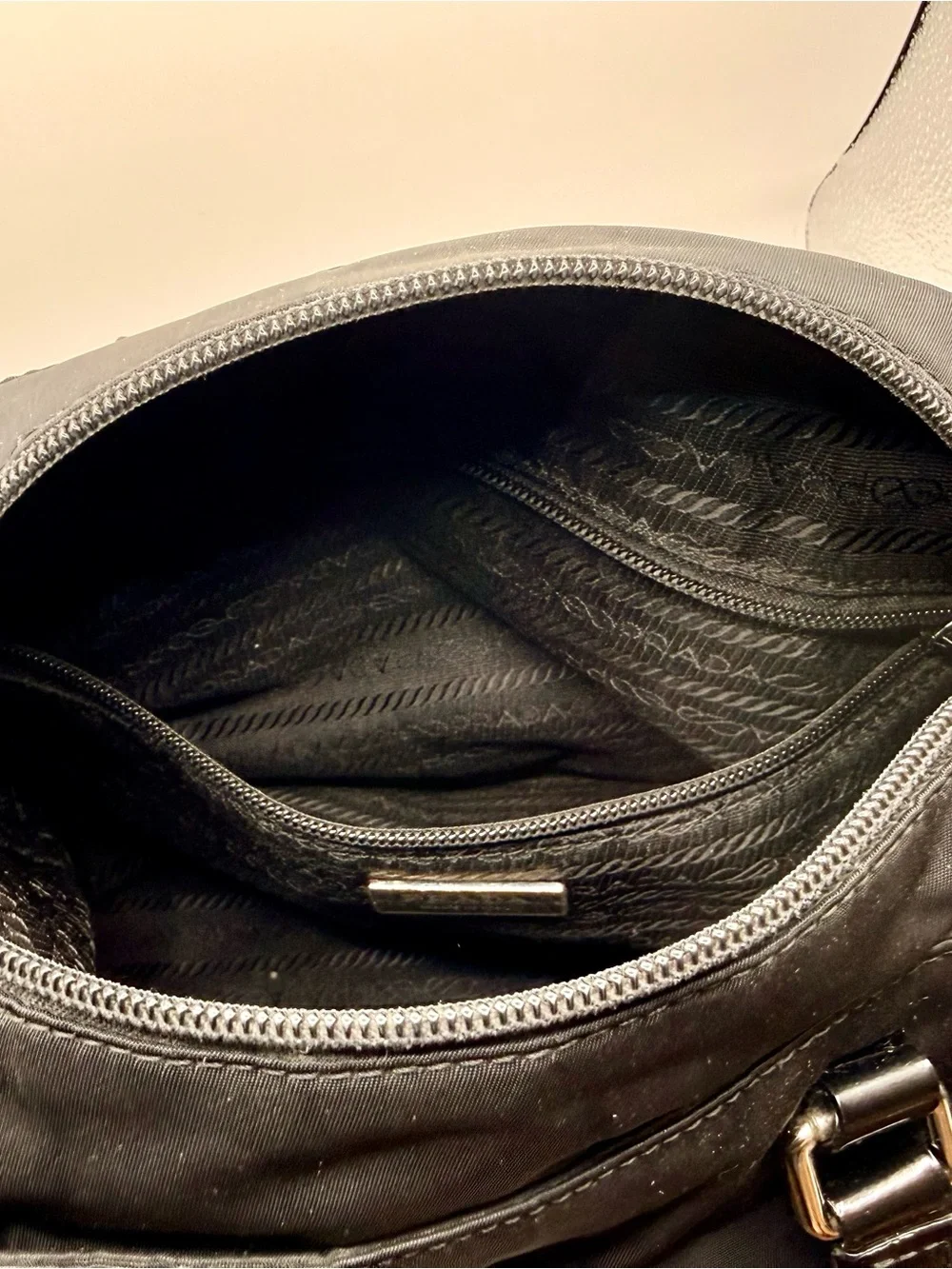Prada Black Nylon & Leather Bag with Embossed Prada logo.
